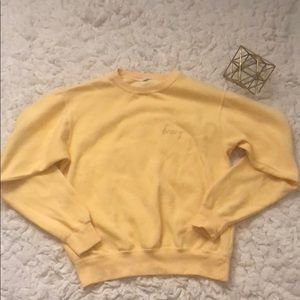 Brandy Melville yellow honey sweatshirt.